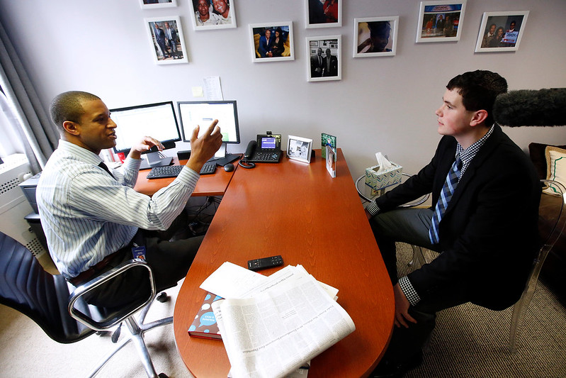 Two men in an office having a discussion
